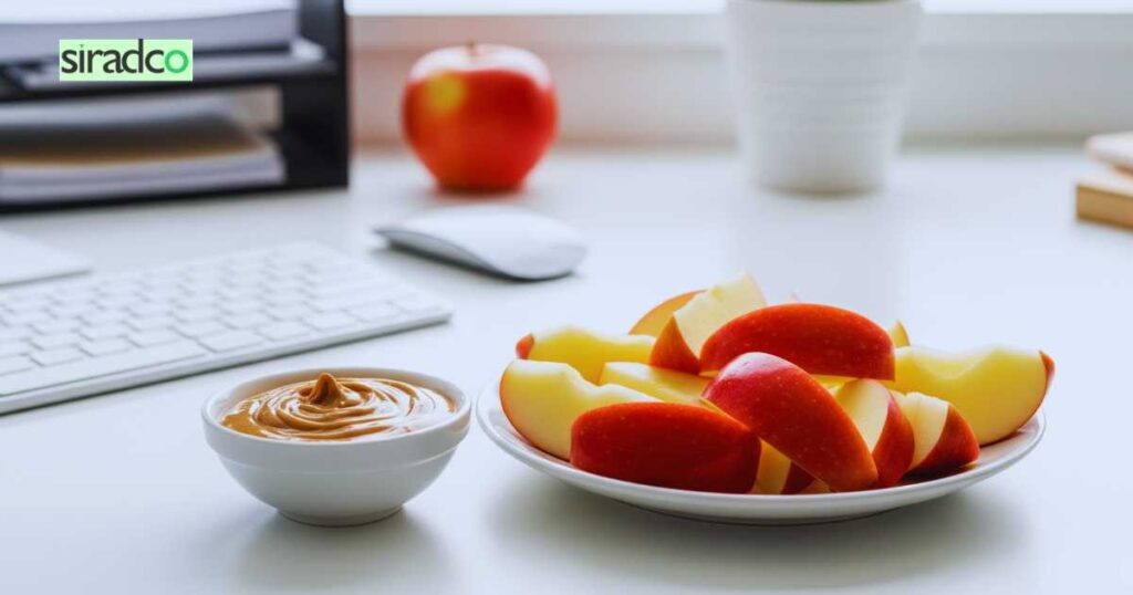 Fresh apple slices with almond butter mood-boosting healthy desk snacks for portable office nutrition