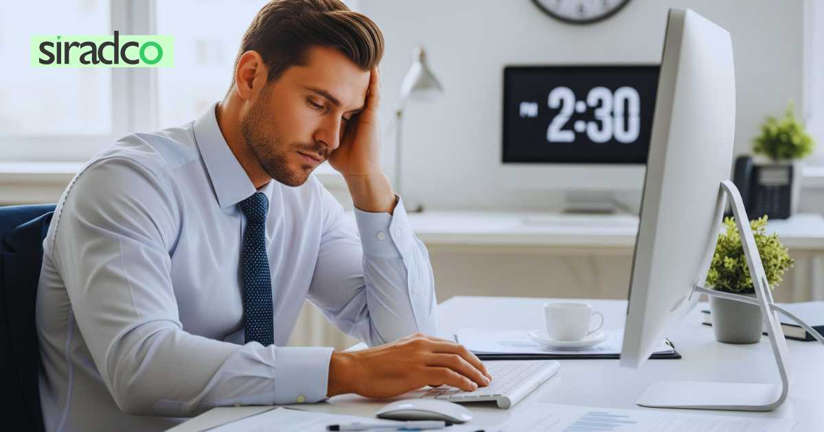 Professional experiencing afternoon energy crash at 2 PM while working at office desk